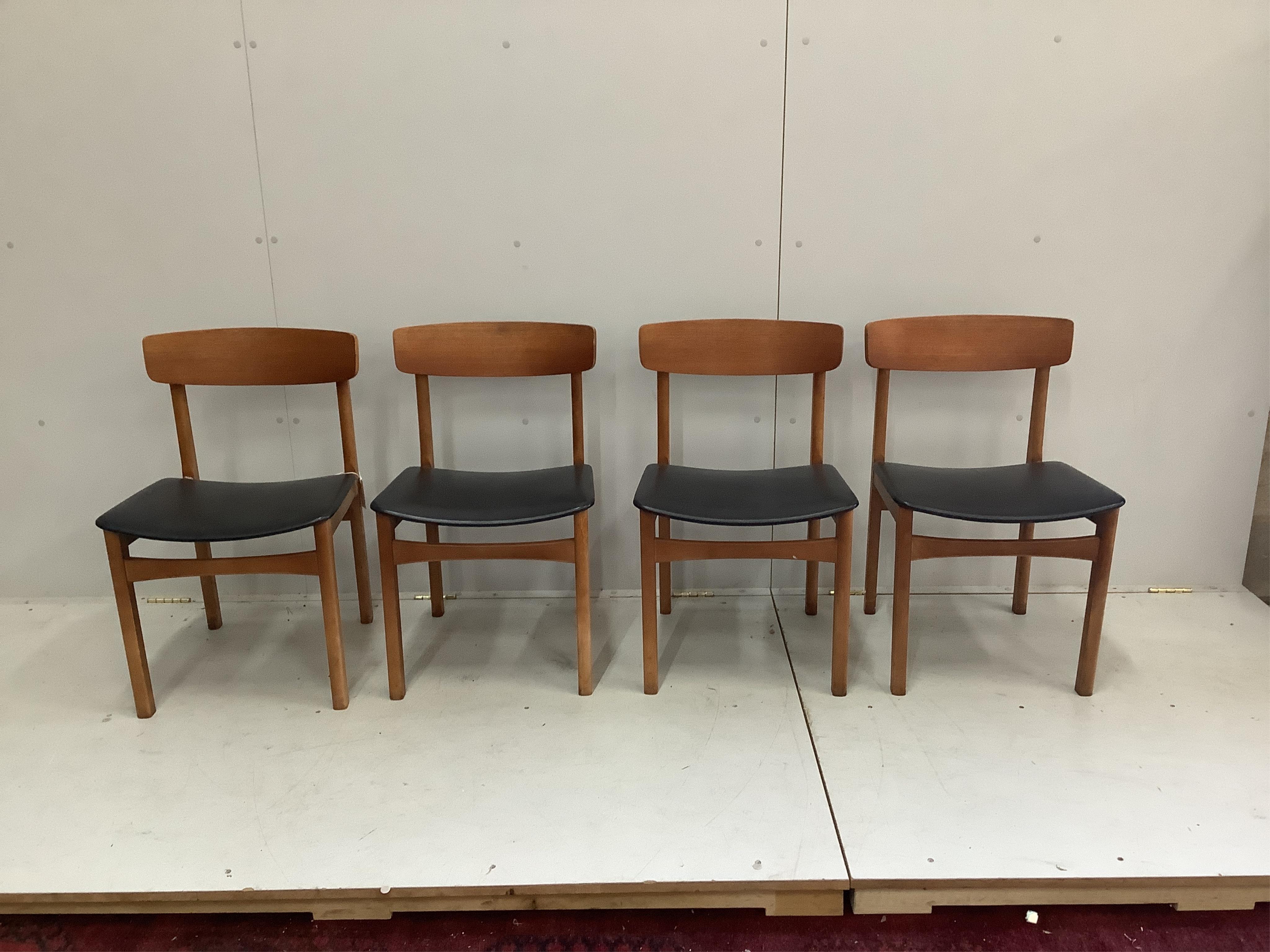 A mid century teak dining table and a set of four chairs. Condition - fair